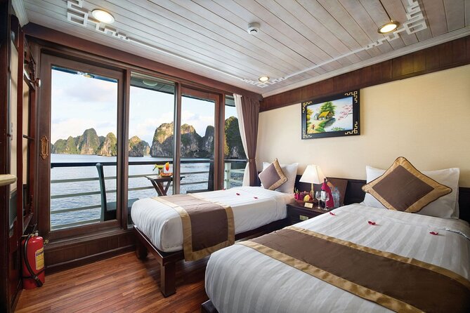 BOUTIQUE CRUISES Halong Bay 2 Days,1 Night Tour: Swimming,Caving, and Kayaking - Day 1: Boarding the Cruise, Settling In, and Watching the Bay Settle