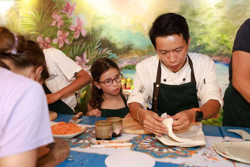 CatBa: Authentic Vietnam Cooking Class and local market tour - Picking ingredients at the market and negotiating like a local