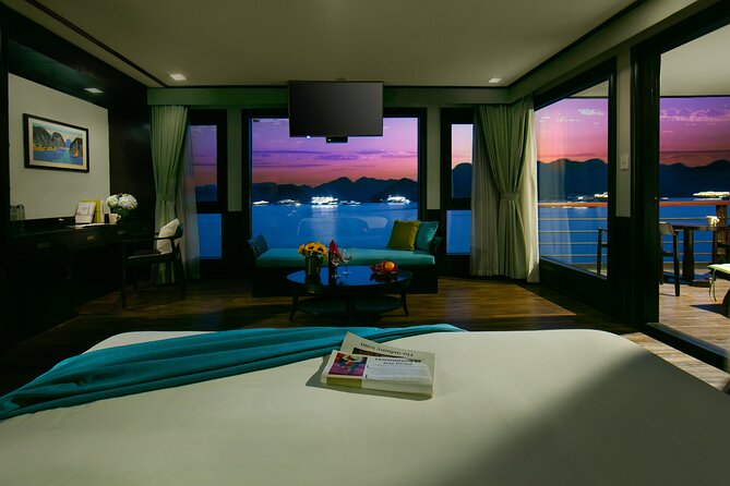 CELINA Cruise 6</em> Lan Hạ Bay 2 days 1 night with 2 ways transfer – Hanoi Old Quarter pickup and the Pearl Center rest-stop’ /><br />
The day starts in Hanoi Old Quarter, where pickup runs between about 8:15 and 8:35 via expressway transport. There’s also a quick stop at the Pearl Center for a restroom break and optional shopping, and that stop is marked as admission-free.</p>
<p><p>Why I think this matters: it reduces the usual stress of getting to a cruise departure on time. When your transport is handled, you spend more energy looking forward to the bay instead of timing buses and taxis. The Pearl Center stop is also a practical checkpoint. Even if you skip shopping, you’ve got a clean reset before the longer ride to the port.</p>
</p>
<p><p>If you’re sensitive to early mornings, plan to leave yourself buffer time before pickup. This kind of schedule works best when you’re already awake and moving, not when you’re still scrambling for breakfast.</p>
</p>
<h2 id="day-1-on-the-bay-onboard-welcome-active-options-and-lan-ha-scenery">Day 1 on the bay: onboard welcome, active options, and Lan Ha scenery</h2>
<p> Lan Hạ Bay 2 days 1 night with 2 ways transfer – Day 1 on the bay: onboard welcome, active options, and Lan Ha scenery’ /><br />
Day one is your “get on the water and learn the rhythm” day. After you arrive at the port around late morning (the schedule lists arrival roughly 11:15 to 11:45), you transition into the cruise experience with a welcome drink and the onboard setup that makes the rest of the day comfortable.</p>
<p><p>From there, the day leans toward active sightseeing. The program includes time in Lan Ha Bay, along with activities like:</p>
</p>
<ul>
<li><strong>Kayaking and swimming</strong> opportunities</li>
<li><strong>Cooking demonstrations</strong> type activity</li>
<li>Visits connected to <strong>local floating villages</strong></li>
<li><strong>Squid fishing</strong> and other onboard experiences</li>
</ul>
<p><p>I like how the activities aren’t treated as random add-ons. They’re spaced so you can alternate between scenic boat time and doing something hands-on. That matters because Lan Ha’s limestone karsts look best when you slow down enough to notice their shape and layers—but you still want moments where you’re physically part of the experience.</p>
</p>
<p><p>One important consideration: kayaking. It’s included, but a review noted a kayaking ban on the bay at least at some times. That doesn’t mean you’ll lose it every day, but it does mean you should be mentally ready for the day-of possibility of restrictions. Your best move is simple: when you board, ask your guide about what’s feasible that day and what the backup plan is.</p>
</p>
<h2 id="the-cabin-upgrade-that-makes-a-short-cruise-feel-worth-it">The cabin upgrade that makes a short cruise feel worth it</h2>
<p><img width="669" height="446" decoding="async" src=