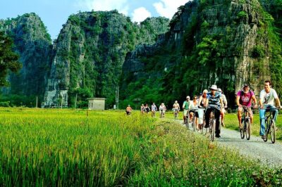Day Tour at Hoa Lu, Tam Coc and Ninh Binh in Vietnam - Tam Cốc sampan boats: Three caves, foot-rowed rowing, and real river life