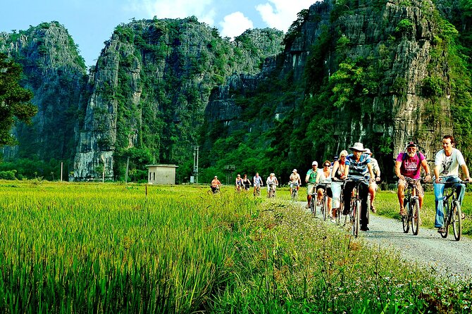 Day Tour at Hoa Lu, Tam Coc and Ninh Binh in Vietnam - Tam Cốc sampan boats: Three caves, foot-rowed rowing, and real river life
