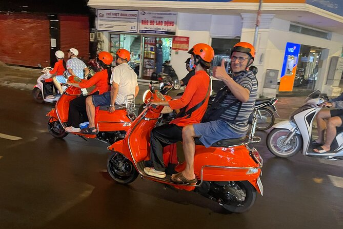 Female Riders Vespa Night Street Food + Train Street food 4 Hours - Stop 1 in the Old Quarter: street stalls and hidden alleys at night