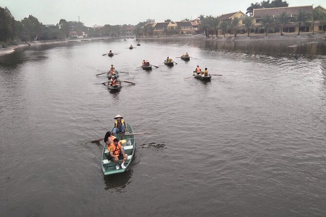 From Ha Noi - FullDay Trip Ninh Binh - Ngo Dong River sampan boat: caves, rice fields, and rowers by foot