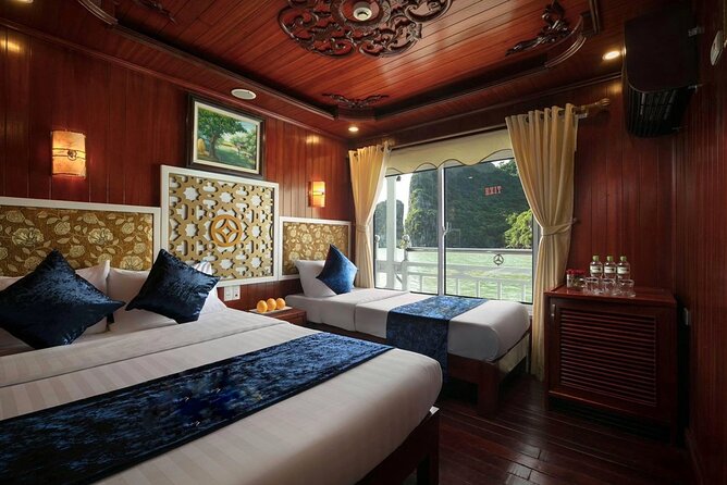 From Hanoi: 2D1N Ha Long Bay Deluxe Cruise with Bus Limousine - Day 1 in Ha Long: Titop Island, Sunset Party, and Nighttime Fun