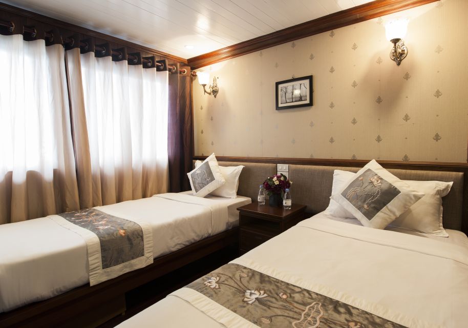 From Hanoi: Halong Explorer 3-Day Deluxe Cruise - Day 1: Luon Cave kayaking, Titop Island hiking, and night squid fishing