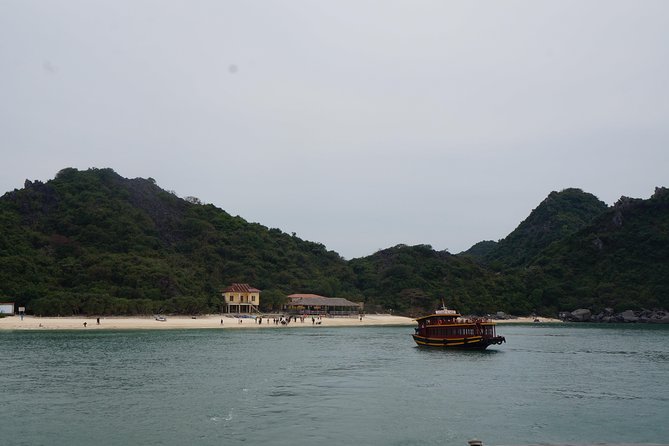 Full day boat trip with Cat Ba Captain Jack to Lan Ha Bay and Ha Long Bay - Traditional onboard lunch, then swimming at three-peaches beaches