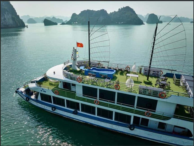 Ha Long Bay- Deluxe Day Cruise, Lunch& Kayaking&Sunset party - Cruising Ha Long Bay: Fighting Cock Islets and the UNESCO Moment