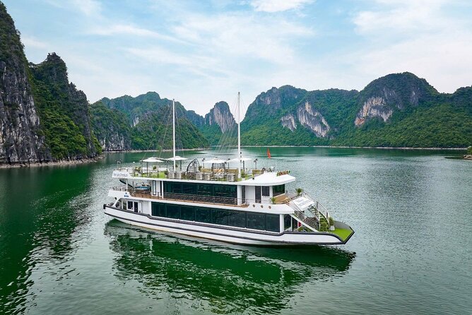 Ha Long Bay Luxury Day Cruise with Buffet Lunch, Caves & Kayaking - Ti Top Island: swim and the viewpoint hike (with rules about anchoring)