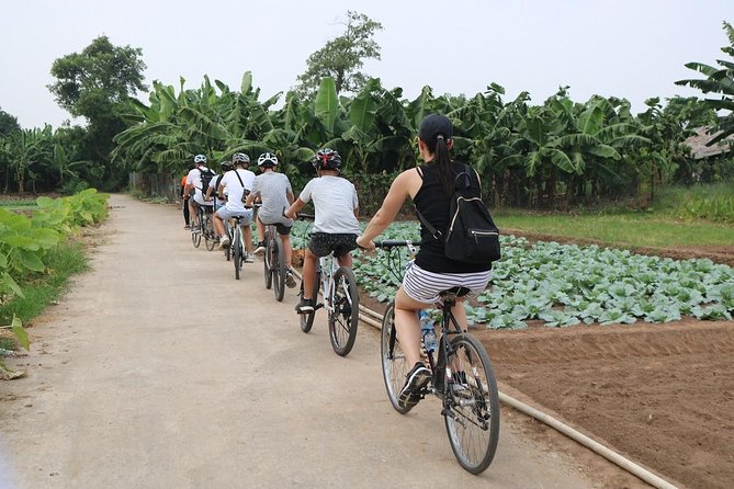 Half-Day Bicycle Tour Combine City & Countryside + Train Street - What’s Included: Helmet, Water, Entrance Fees, Egg Coffee, and Rain Ponchos