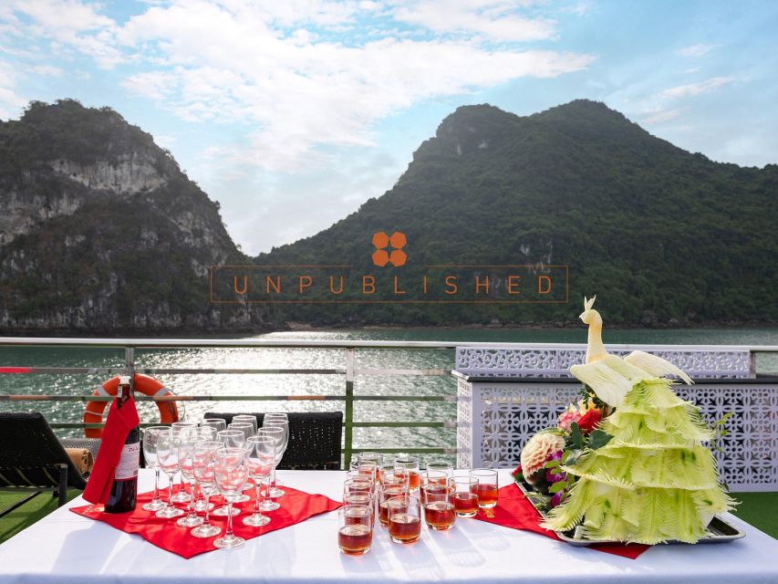 Halong Bay Delights: Deluxe Day Cruise with Kayaking & Lunch - Sunset party on the return: teas, red wine, cake, and fruit
