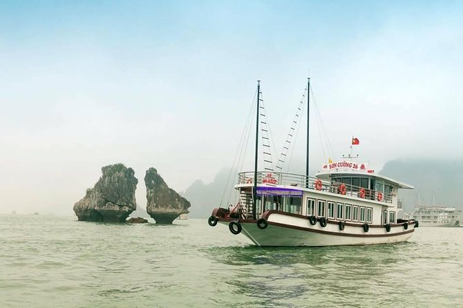 Halong Bay Islands and Caves: Full-Day Tour from Hanoi - Floating Village Time: Bamboo Boat Paddling and Market Views