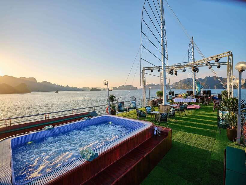 Halong Bay Luxury Cruise: Kayak&Swim,Cave, Party BEST SELLER - Sunset party on the sundeck: when the day shifts from action to relax