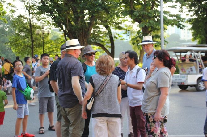 Hanoi City Street Food Night Tour by Motorscooter - Dong Xuan Market and the quick landmark stops that keep it moving