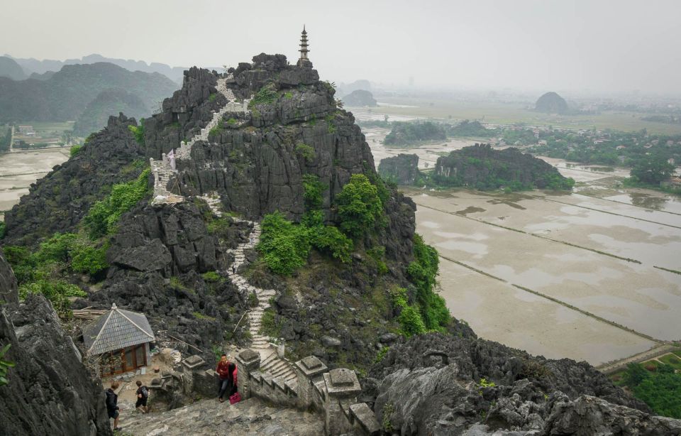 Hanoi: Full Day Guided Tour of Hoa Lu, Tam Coc, and Mua Cave - Tam Coc Bamboo Boat: 1.5 Hours Through Caves and Paddy Fields
