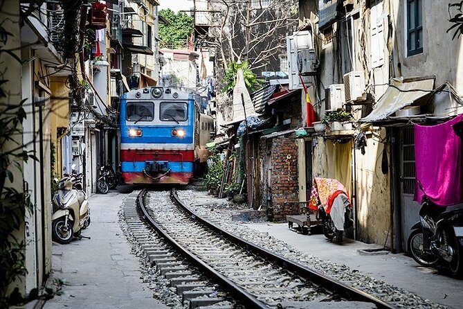Hanoi Michelin Star Street Food Walking Tour & Train-Street - Bạch Mã Temple and the alley-walk rhythm