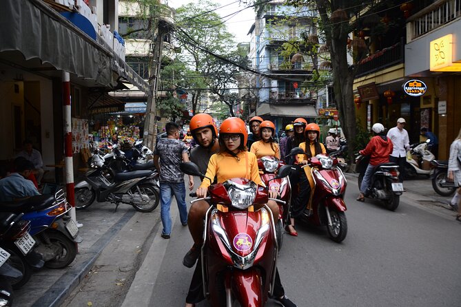 Hanoi Motorbike Tour Led By Women - City And Countryside Full Day - Long Bien Bridge first: history, then a tea-and-bonsai pause