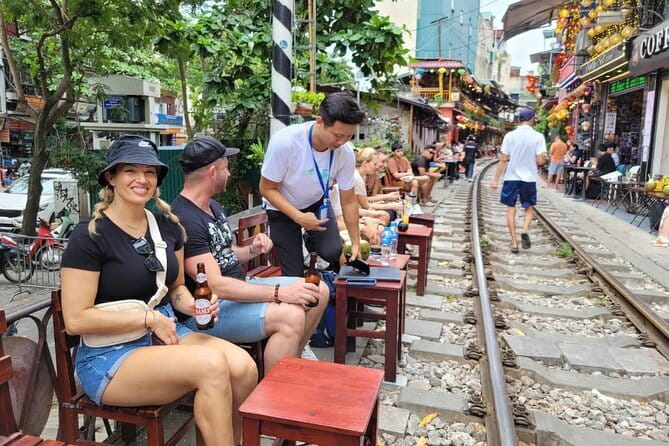 Hanoi street food walking and train street visit - Train Street up close: coffee and the rail-in-the-neighborhood moment