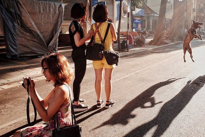 Hanoi Street Photography in a Vintage Community - Roadside tea stalls: quiet moments inside noisy lanes