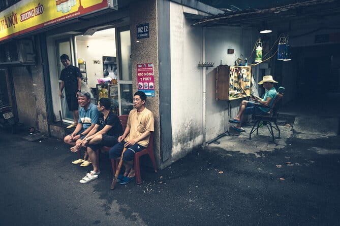 Hanoi Street Photography in a Vintage Community - The architecture walk: aging walls, staircases, and wire-filled frames
