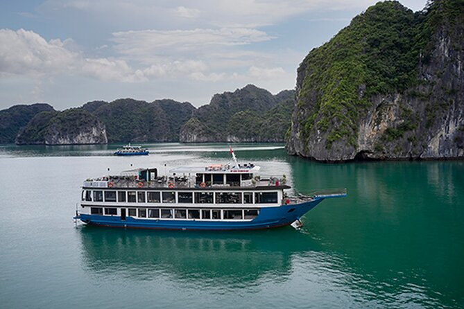 Lan Ha Bay Overnight Cruise with Kayaking, Tai Chi, Swimming,... - Day 2 sunrise at Hang Tối and the cave-by-rowboat experience