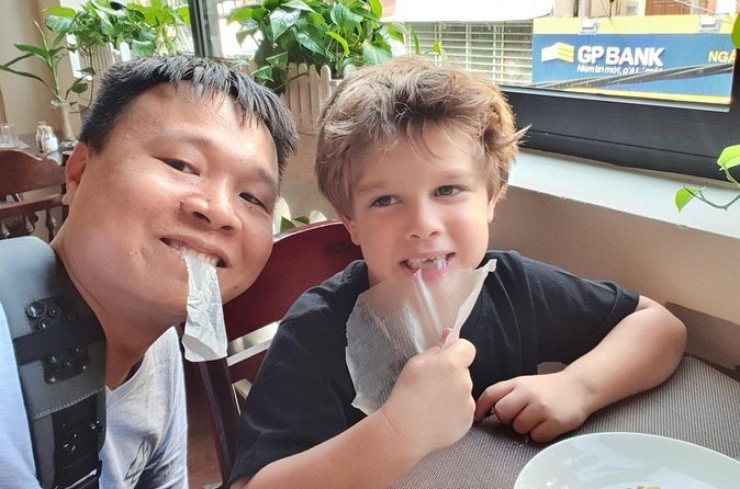Private kid-friendly Hanoi food tour with a taste of great dishes - Passing Hoan Kiem Lake: a quick Hanoi snapshot without slowing down