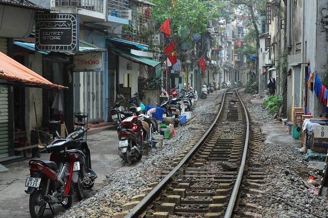 Small-group motorbike sightseeing and food tour in Hanoi - Old Quarter start: gate, market views, and Hang Ma street craft