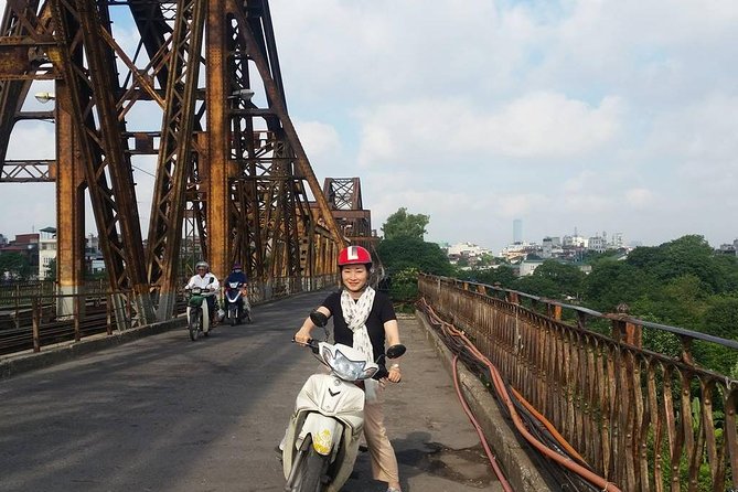 Small-group motorbike sightseeing and food tour in Hanoi - Duờng Tau train street and Hanoi Flag Tower history in one route