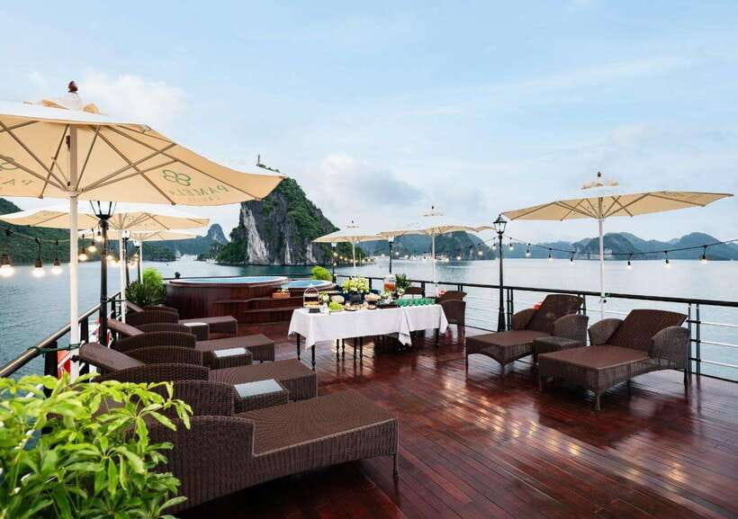 The BEST Ha Long Bay 5-Star Day Trip with Pamela Cruise - Sunset Party and ship time: pool, snacks, and the Fighting Cock islet